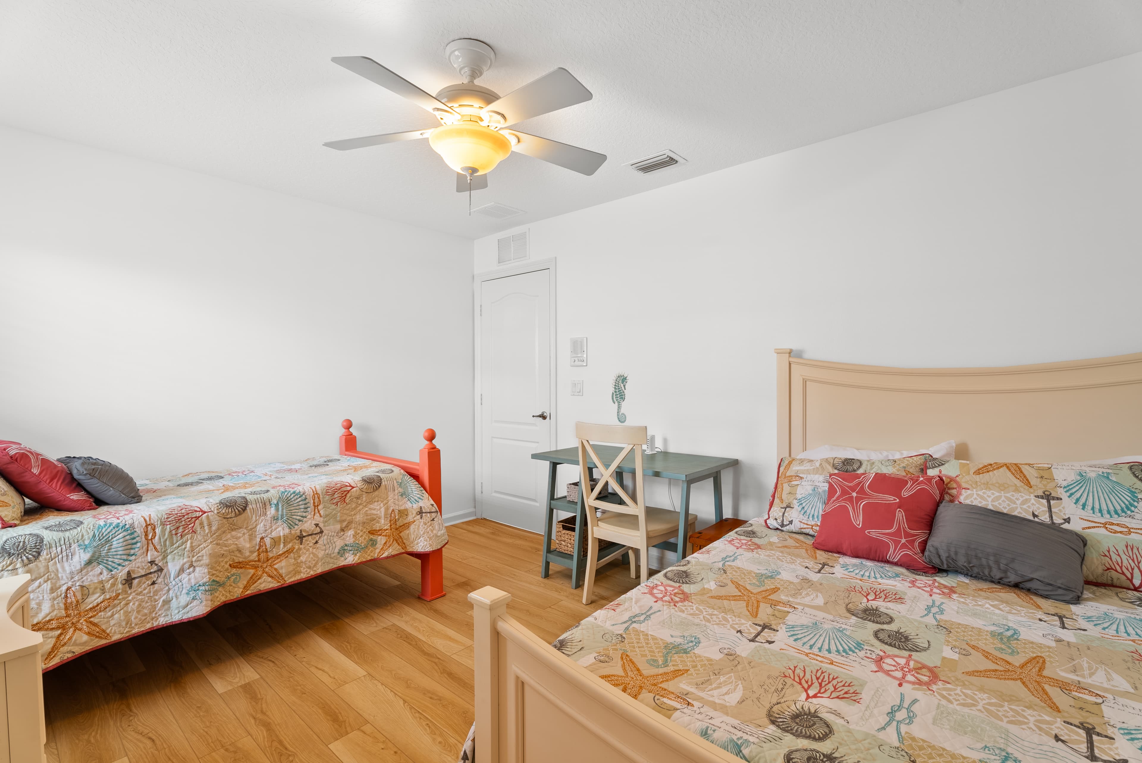 Bright twin bedroom with ample storage space