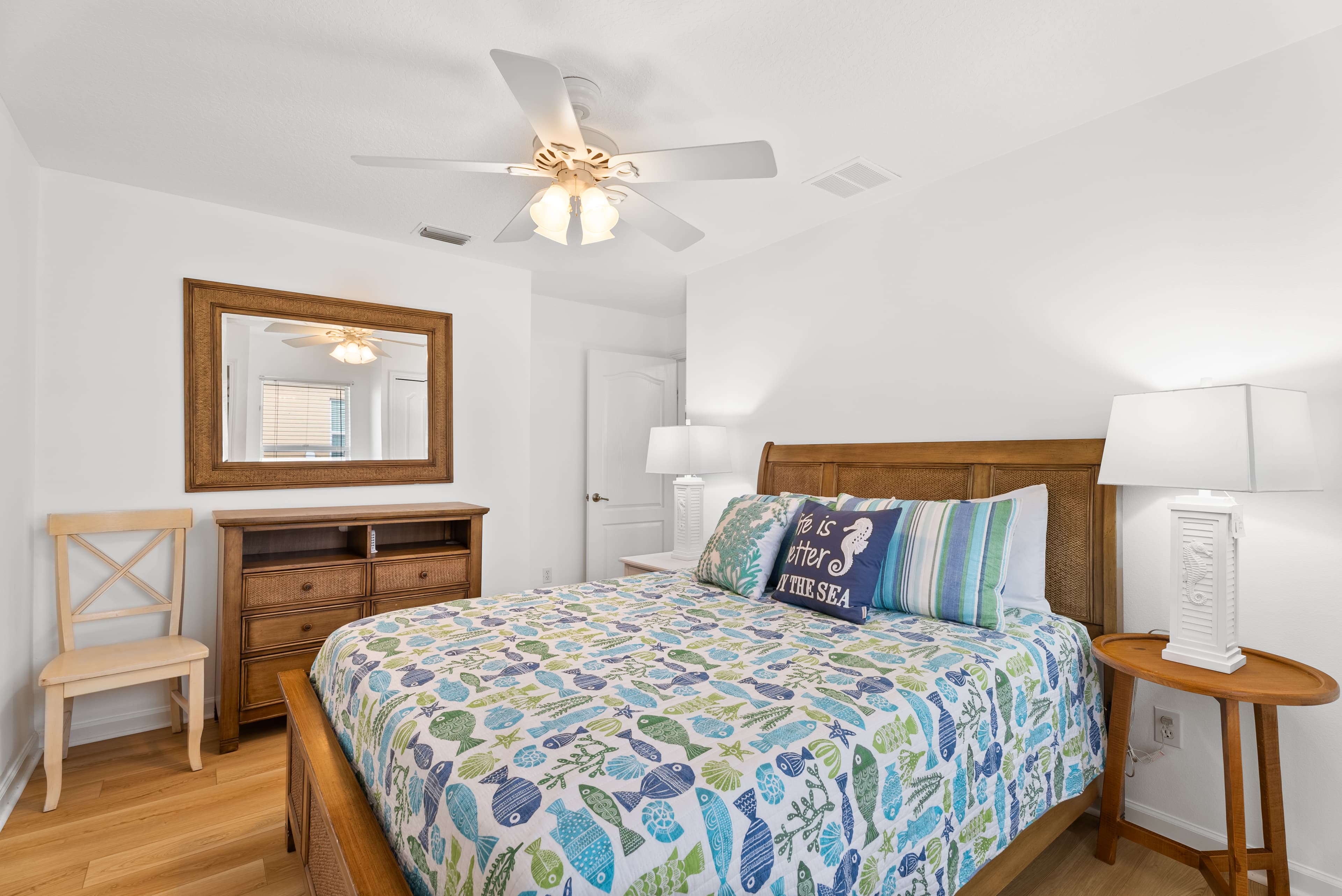 Second view of queen guest bedroom with window