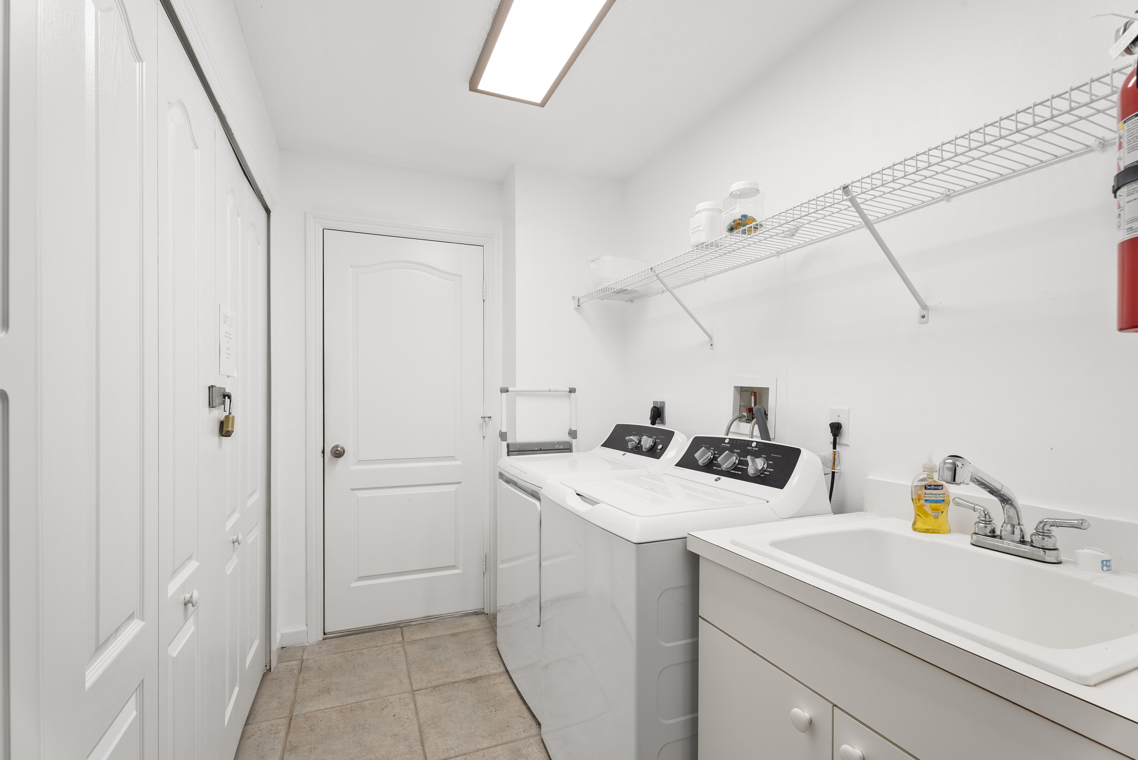 Full-size washer and dryer in laundry room