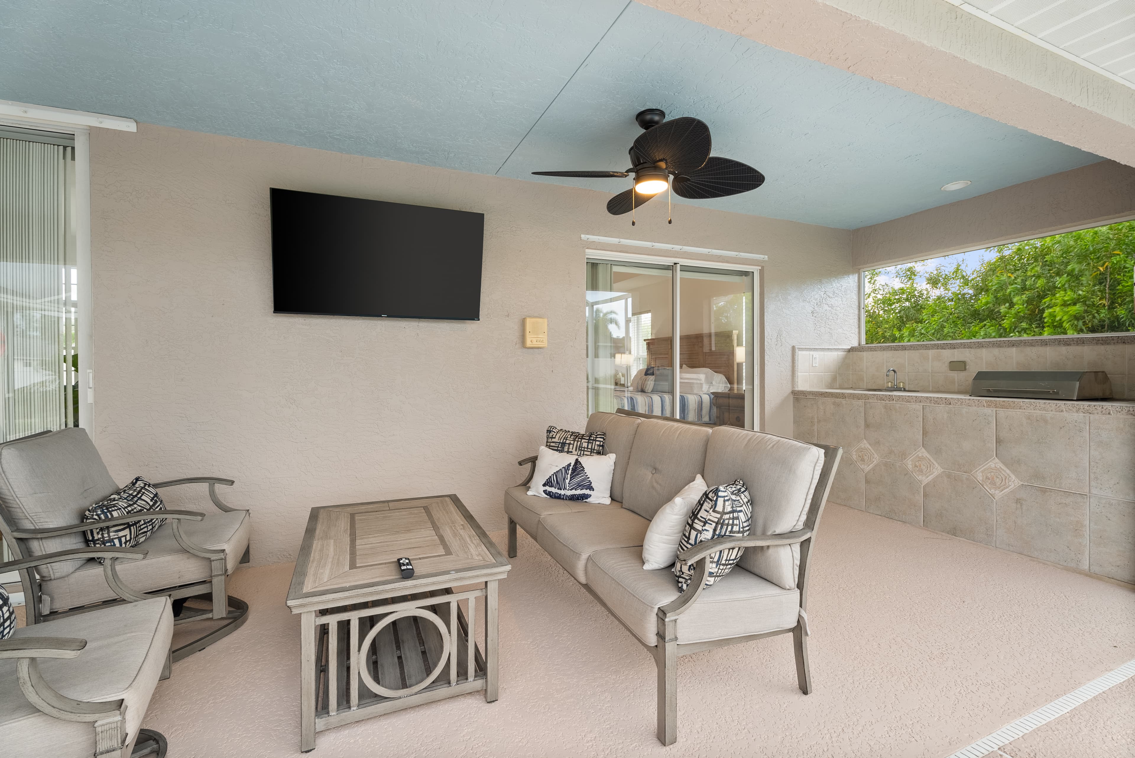 Covered patio with outdoor TV entertainment